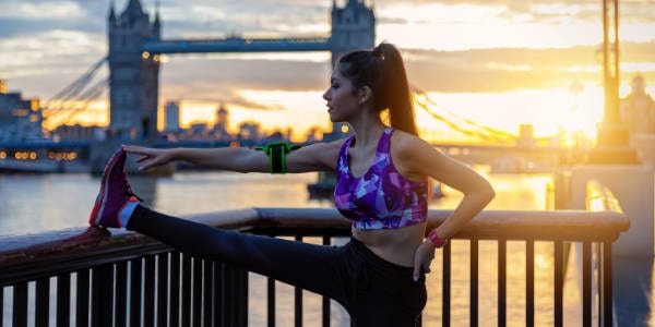 Female runner stretching before running in London