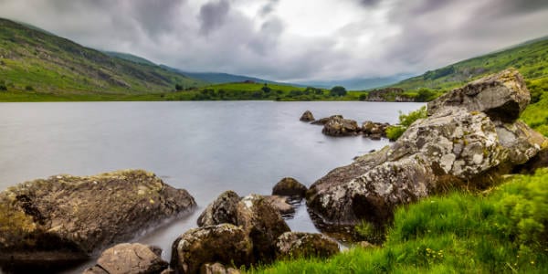 A lake set in the Snowdon landscape in Wales