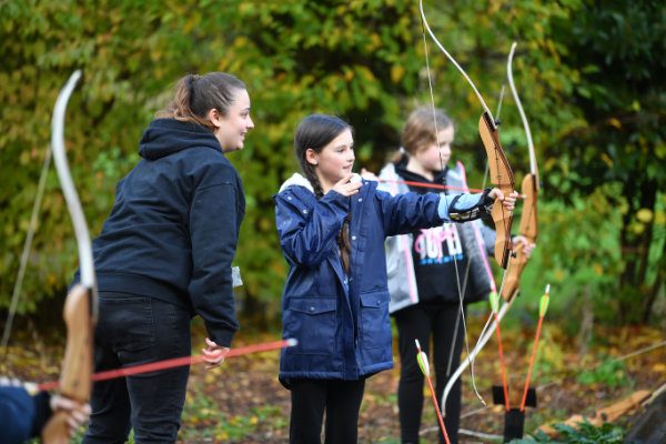 School children doing archery at YHA Chester Trafford Hall